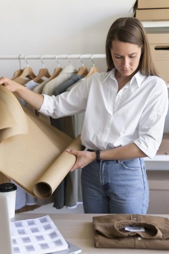 medium-shot-woman-holding-wrapping-paper